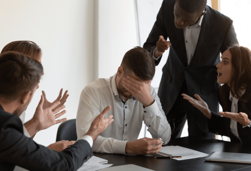 Frustrated-employee-feels-stressed-suffers-from-hostile-coworkers